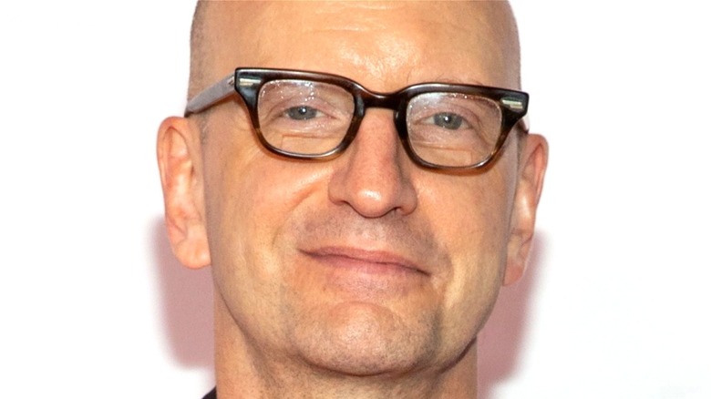 Steven Soderbergh smirking at an event