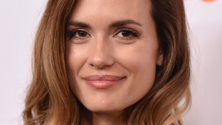 Torrey DeVitto smiling