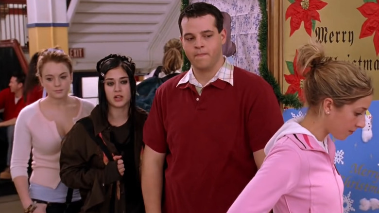 Cady, Janis and Damian stand in line
