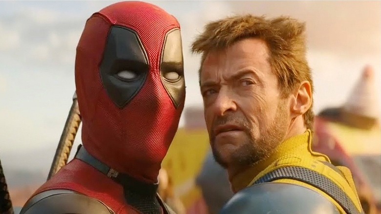 Ryan Reynolds as Deadpool and Hugh Jackman as Wolverine stand face-to-face