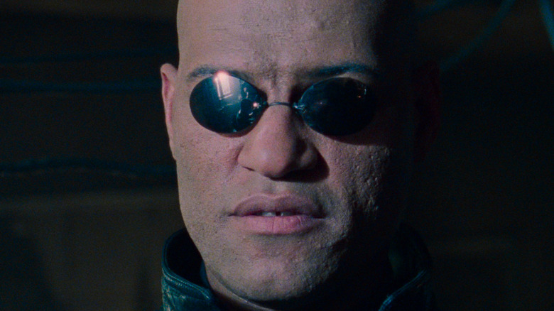 Morpheus with sunglasses, looking at camera