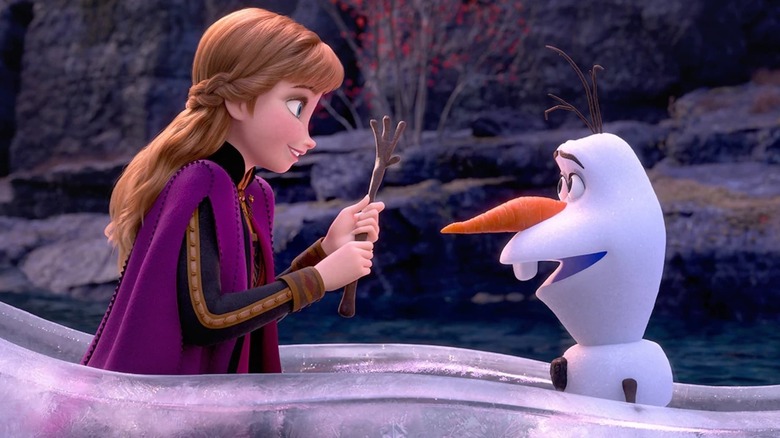 Anna holds Olaf's hand