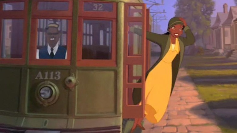 Tiana riding on trolley