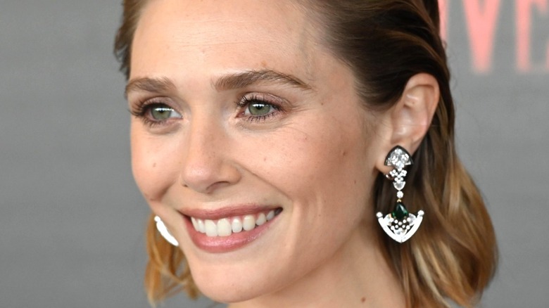 Elizabeth Olsen wears diamond earrings 