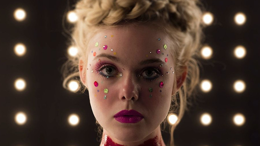 Elle Fanning bloody and glittered