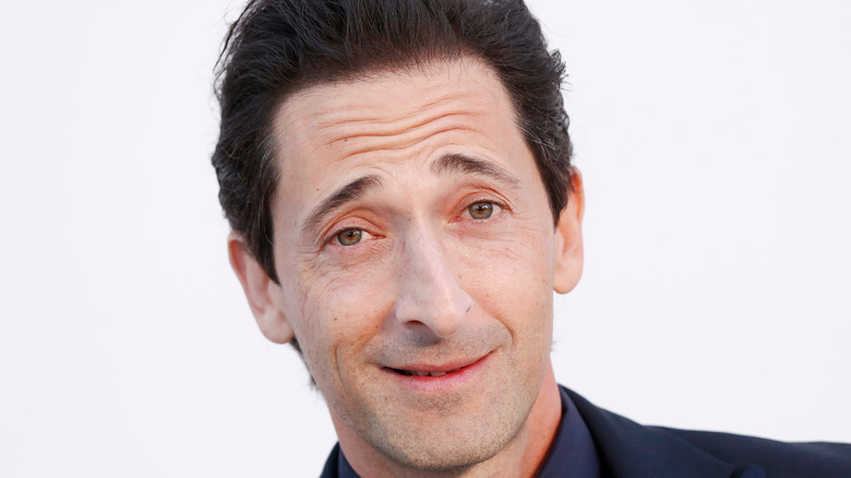 Adrien Brody poses at event 