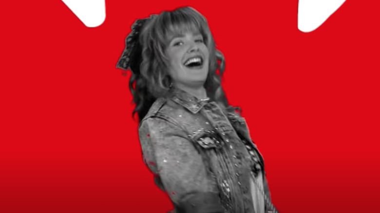 Robin Sparkles in front of Canadian flag graphic
