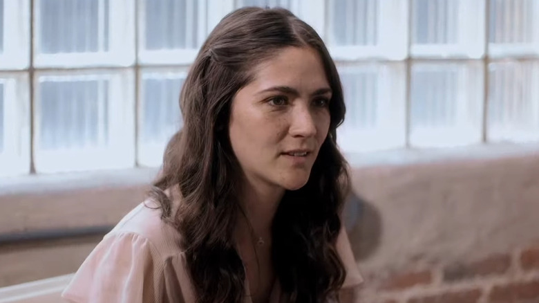 Pearl looking serious to the right