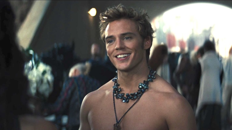 Shirtless Finnick smiles 