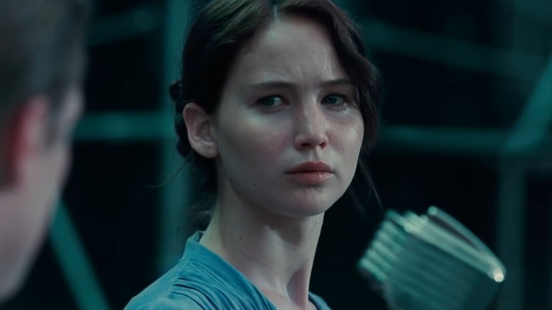 Katniss Everdeen looking at Peeta Mellark