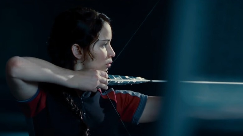 Katniss Everdeen about to shoot an arrow