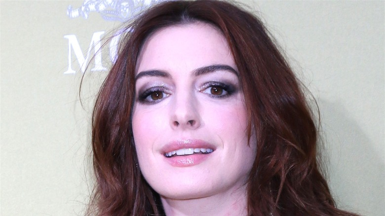 Anne Hathaway smiles