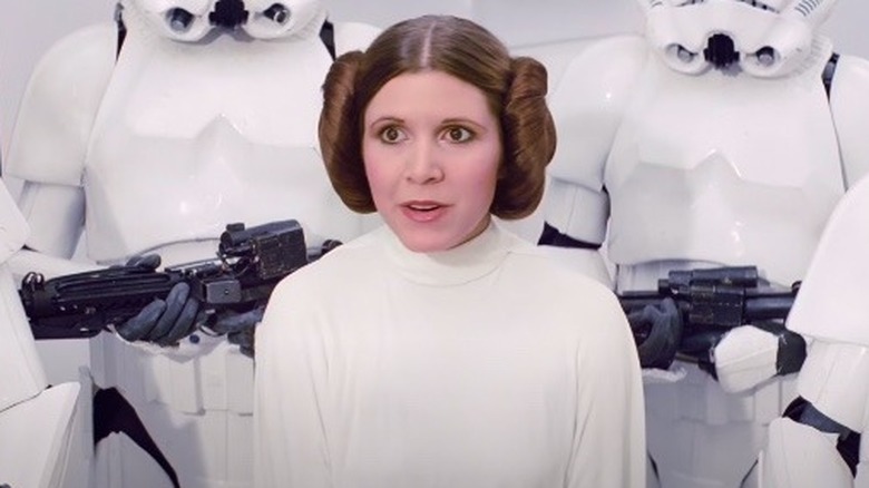 Carrie Fisher as Leia talking in "Star Wars" (1977)