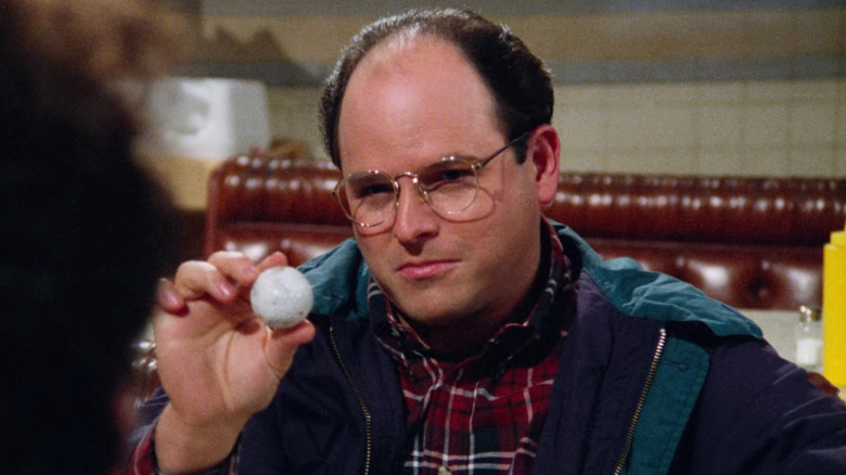 George Costanza holding golfball