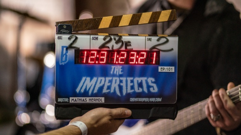 A clackboard with the title The Imperfects