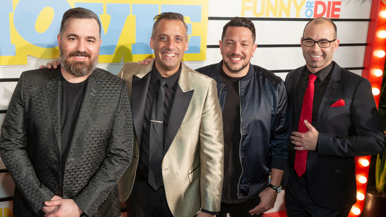 Impractical Jokers smiling in a row