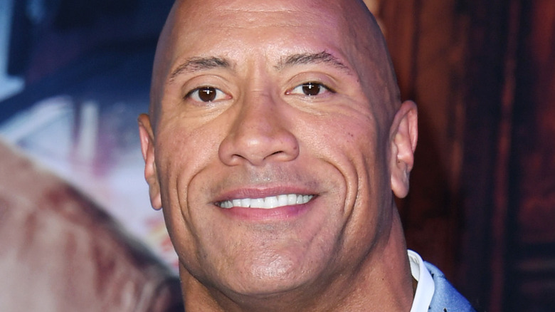 Dwayne Johnson smiling at the Jumanji premiere