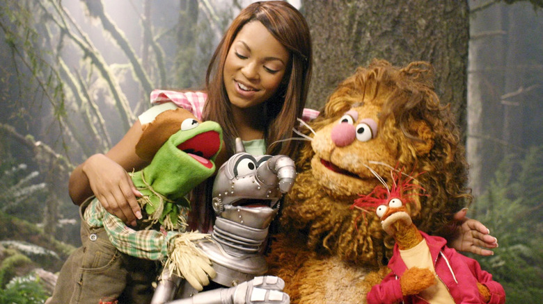 Dorthy and the gang hugging and singing in The Muppets' Wizard of Oz
