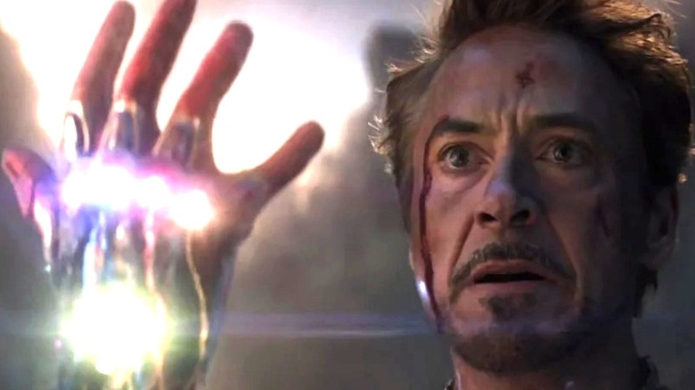 Iron Man holding up Infinity Gauntlet