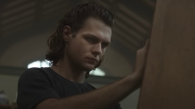 Dalton paints at an easel