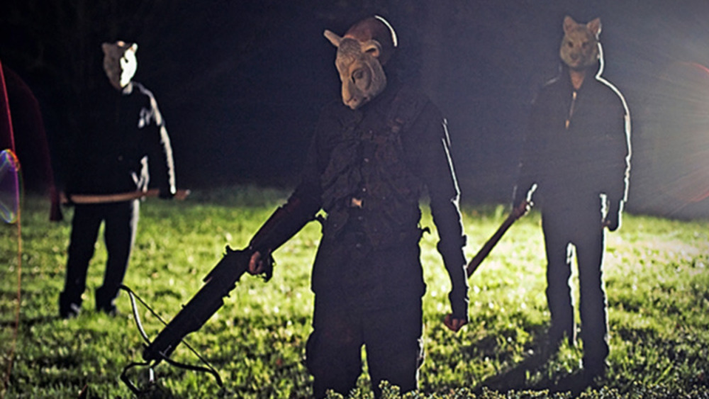 Three masked invaders with weapons 