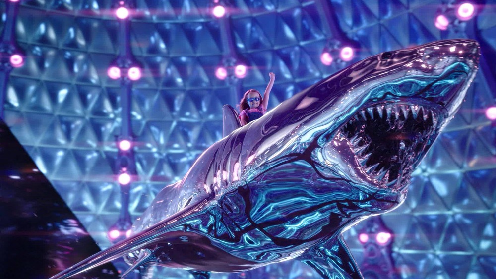 Sharkboy and Lavagirl's daughter rides a glass shark in We Can Be Heroes