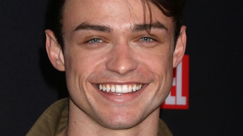 Thomas Doherty smiling at event