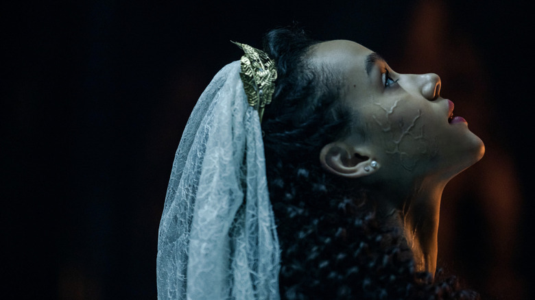 Evie wearing veil with veins on her cheek