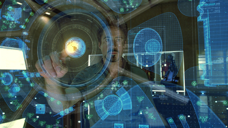 Tony Stark works with his digital interface in 