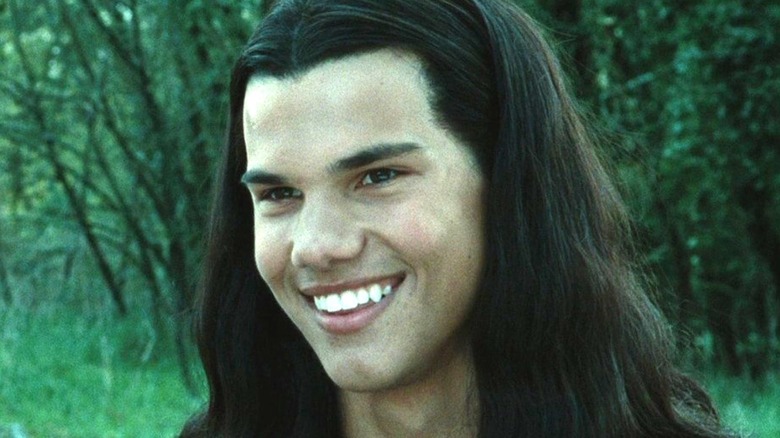 Jacob Black with long hair in the forest