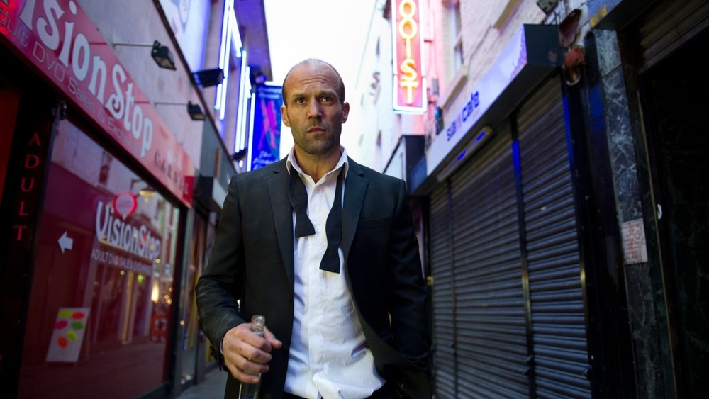 Jason Statham walks through city