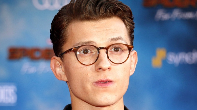 Tom Holland wearing glasses