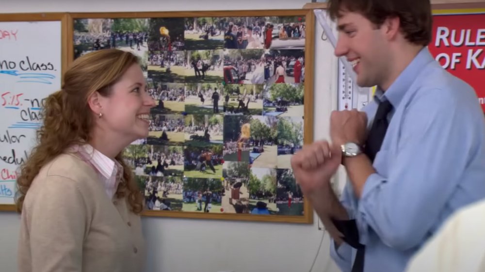 Jim and Pam smile at each other on season 2, episode 6 of The Office