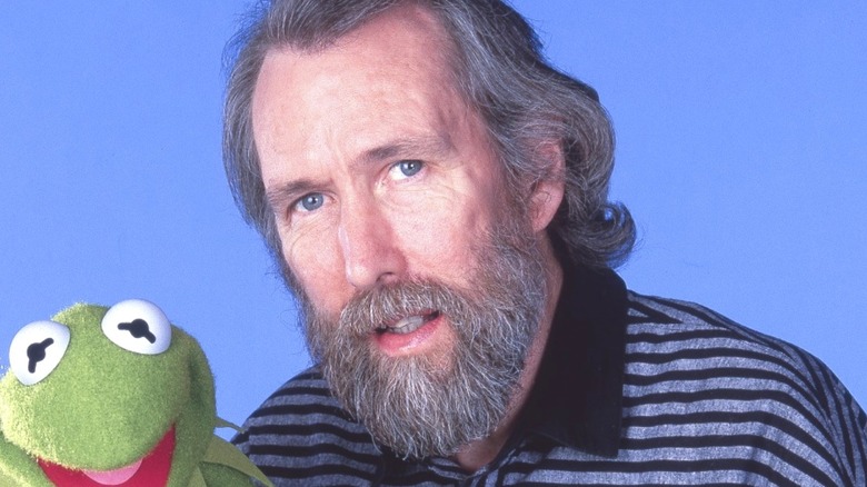 Jim Henson posing with Kermit