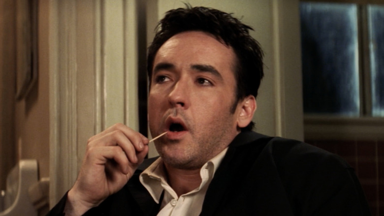 John Cusack uses toothpick