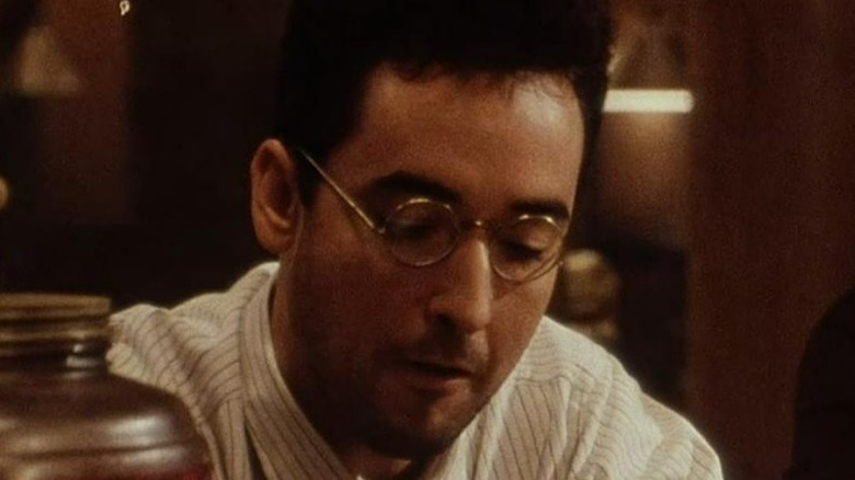 John Cusack looks down