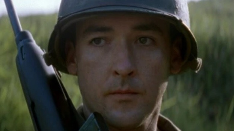 John Cusack looks to side with gun