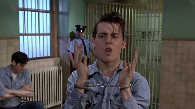 Cry Baby in handcuffs