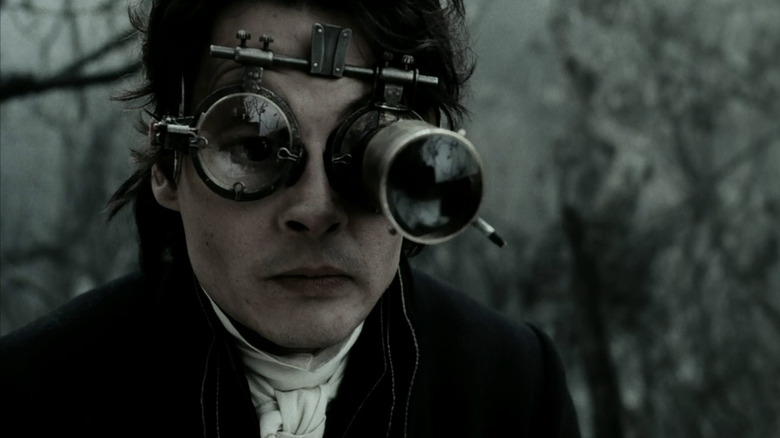 Ichabod Crane looks through binoculars