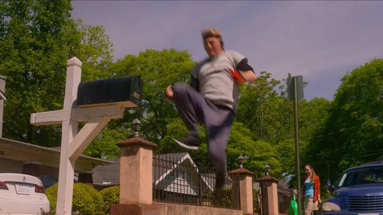 Johnny Lawrence kicking a mailbox