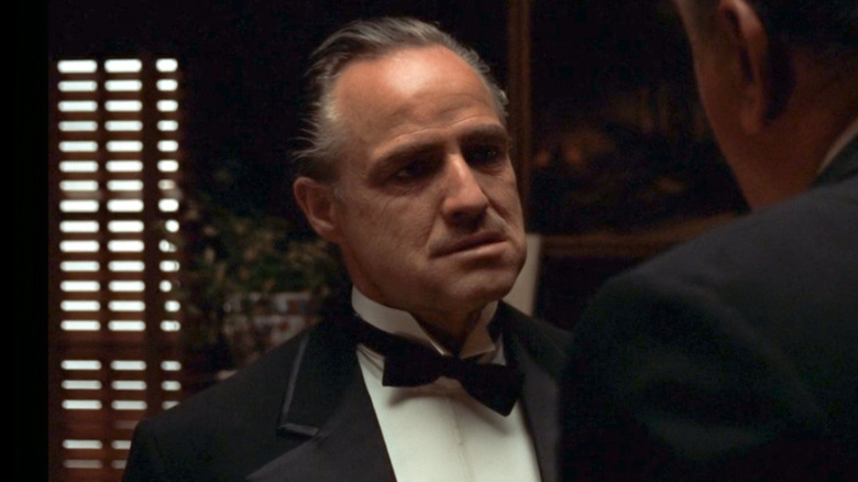 Vito Corleone talking to Luca Brasi