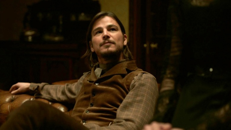 Ethan Chandler relaxing on a fancy couch in "Penny Dreadful"