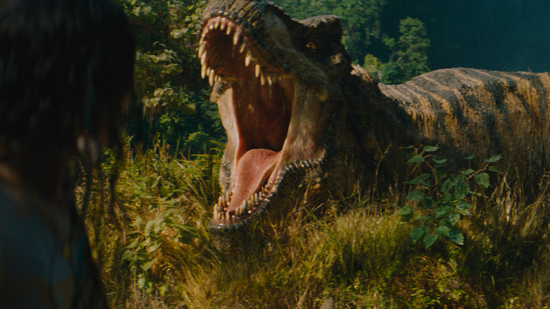 A T-rex screeches in the jungle in "Jurassic World Rebirth" (2025)