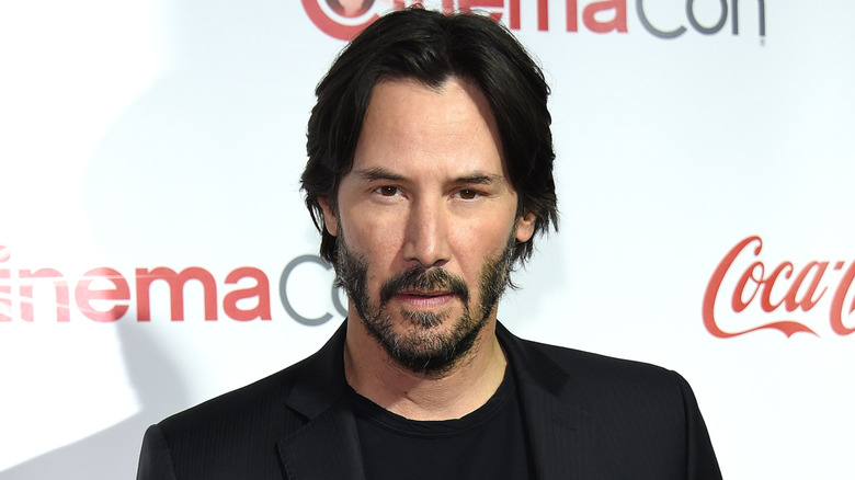 Keanu Reeves wearing a black shirt