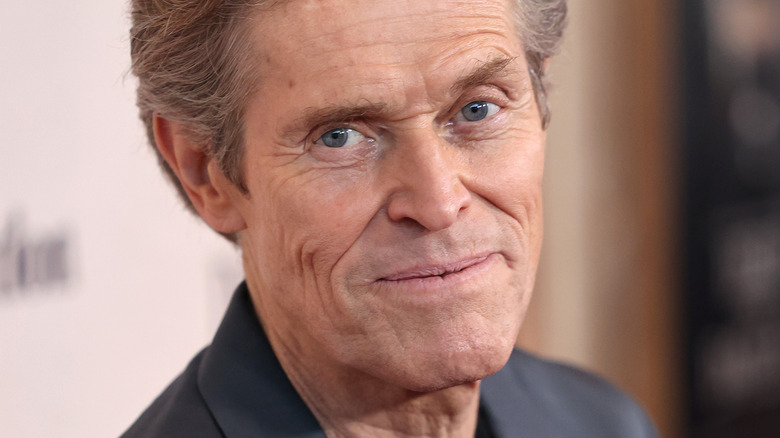 Willem Dafoe smiling