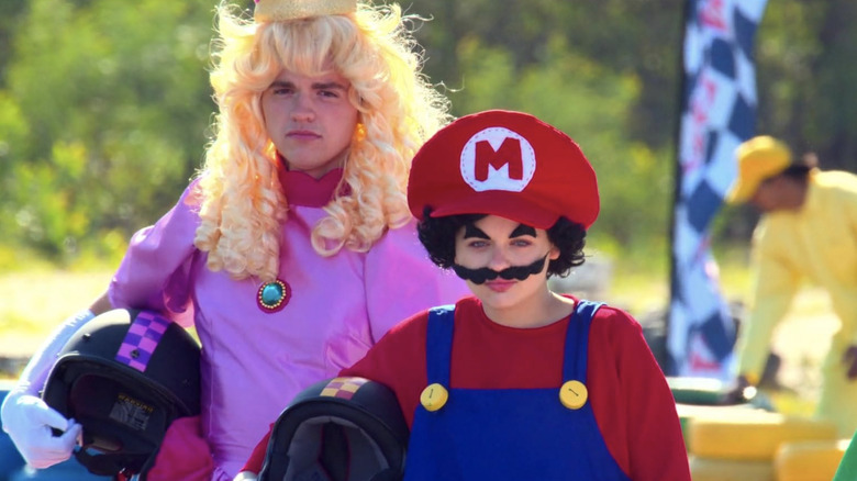 Elle and Lee dressed as Mario and Princess Peach, respectively, while preparing to go kart race in "The Kissing Booth 3"
