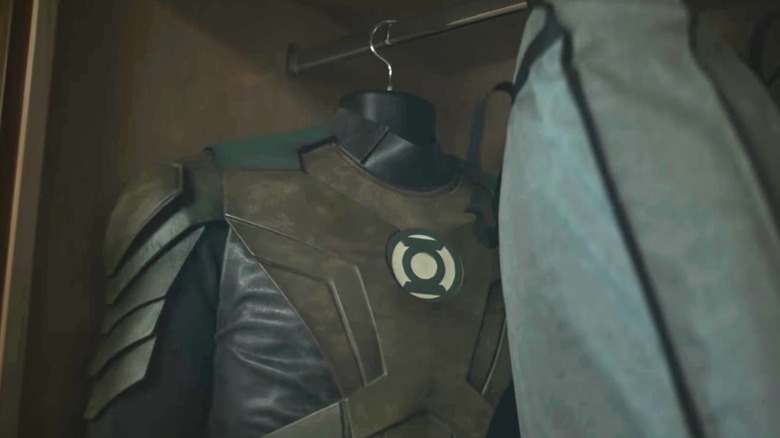 A Green Lantern costume hanging in a closet on "Lanterns" (2026)