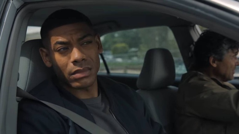 John Stewart in a car with Hal Jordan driving on Lanterns