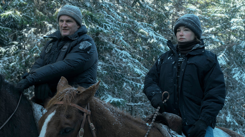 Frank and Sidney riding horses outdoors