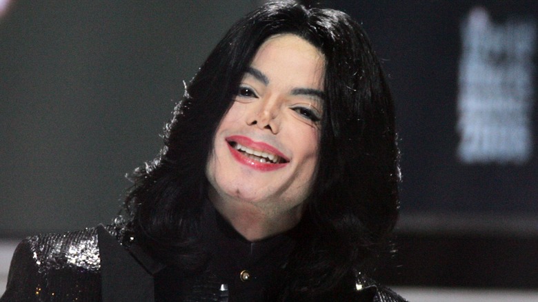 Michael Jackson smiling wearing black